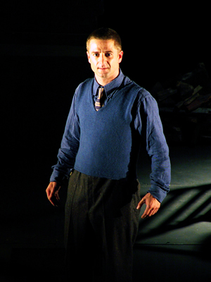 Sitting in scaffolding, Young Jacques is cradled by older Jacques, leaning back into his shoulder.